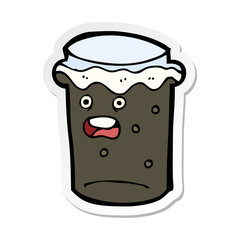 sticker of a cartoon glass of stout beer