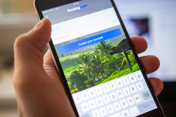 Booking application on mobile smartphone screen. Username and password for booking.com