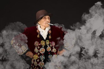 Old woman wearing a vermilion velvet jacket