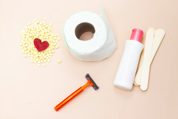  Personal hygiene : Toilet paper roll and yellow wax, wooden stick, shaver and intimate lotion