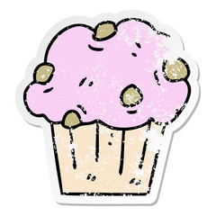 distressed sticker of a quirky hand drawn cartoon muffin cake