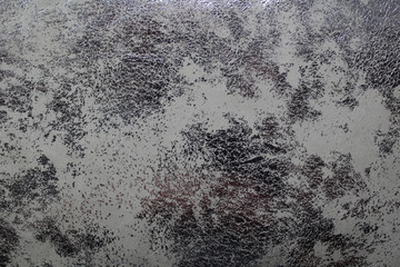 Silver brilliant background, old metal effect, similar to skin of a snake. Texture attrition on...