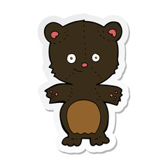 sticker of a cartoon black bear cub