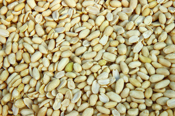 peeled raw peanuts in the market. pile of nuts