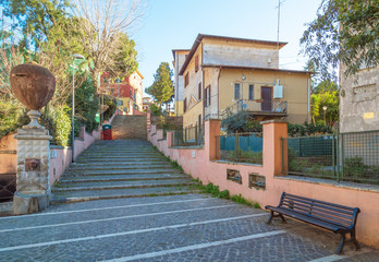 Rome (Italy) - The suggestive popular Garbatella quarter in Ostiense district, an agglomeration in Rococo style with gardens and the famous modern bridge named Settimia Spizzichino - obrazy, fototapety, plakaty