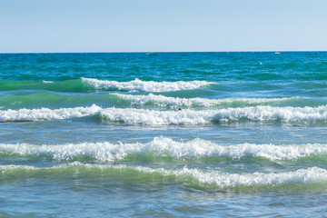 Wonderful, turquoise Mediterranean, gentle waves, white foam