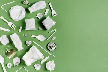 Plastic waste collection on  green background. Concept of Recycling plastic and ecology. Flat lay, top view