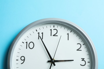 Fototapeta na wymiar Big beautiful clock on blue background, space for text