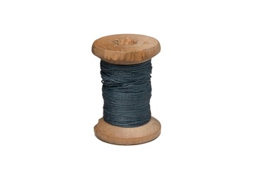 Wooden coil with thread on a white isolated background