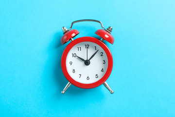 Retro alarm clock on color background, space for text