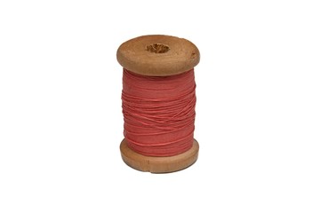 Wooden coil with thread on a white isolated background