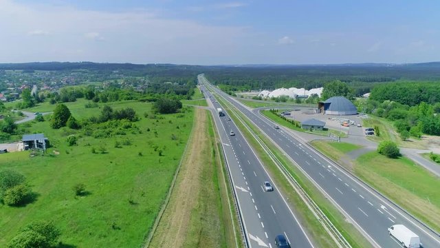 Cars and trucks driving on the highway in Poland A4 road. Aerial view from drone, from above
