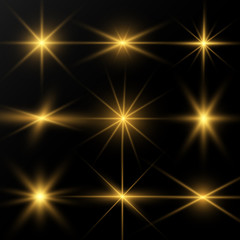 A set of bright beautiful stars. Light effect. Bright Star. Beautiful light for illustration. Christmas star.White sparkles shine special light effect. Vector sparkles on a transparent background