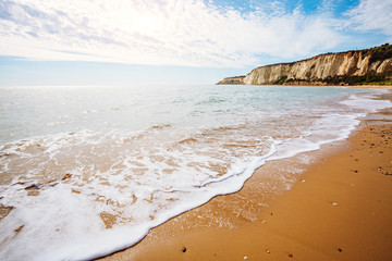 Breathtaking sea with white fluffy clouds. Outdoor vacation.