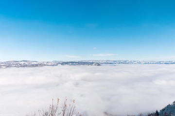mountain top view point. winter mountains with clouds.