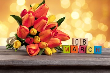 Different color tulips on background