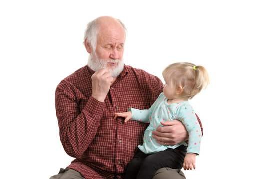 Old good grandpa and his little granddaughter
