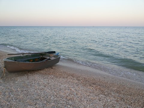 abandoned boat at sea coast