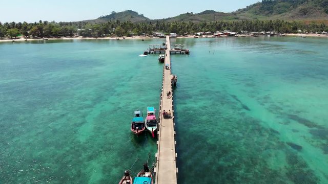 Ko Muk (also called "Koh Mook") is an island in the southern Andaman coast. This small island can be reached via this pier. On this video you can see an aerial view of the pier and its motor taxis.