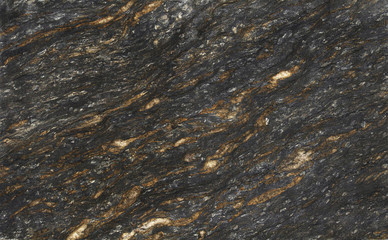 Closeup dark granite with natural pattern texture background.