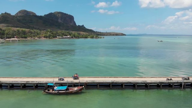 Ko Muk (also called "Koh Mook") is an island in the southern Andaman coast. This small island can be reached via this pier. On this video you can see an aerial view of the pier and its motor taxis.