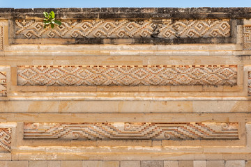 Elaborate fretwork found in old ruins in Oaxaca, Mexico. Intricate stone detail found in the archaeological site of Mitla