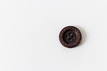 close up on button, white background