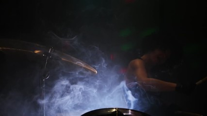 end performance of musician by drumroll on drum plate.