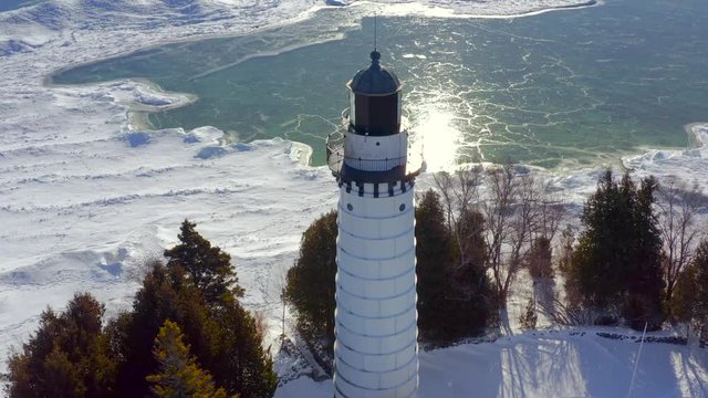 Scenic Cana Island Lighthouse, Door County, Wisconsin in Winter, aerial flyby.