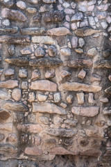Stone rocks used to create a subtle pinkish wall. Old wall detail with rich textures