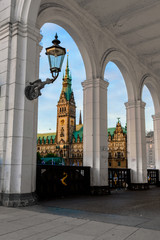 The City Hall of the Hanseatic City of Hamburg framed by wite arcades on Jungfernstieg on the Alster