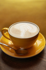 Latte in the yellow cup