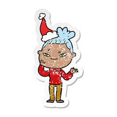 distressed sticker cartoon of a woman wearing santa hat