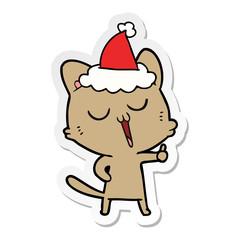sticker cartoon of a cat singing wearing santa hat