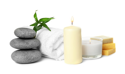 Obraz na płótnie Canvas Beautiful spa composition with candles and stones on white background