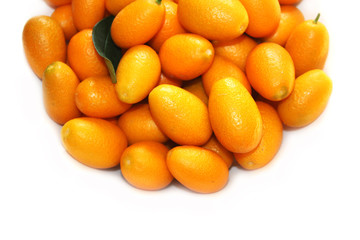 Small oranges on the white background. Nature fruits background.