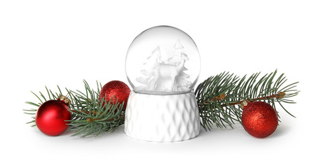 Magical snow globe with pine branches and Christmas balls on white background