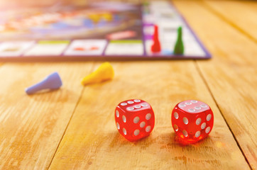 board game with cubes and chips on a wooden background