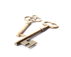 Bronze vintage ornate keys on white background