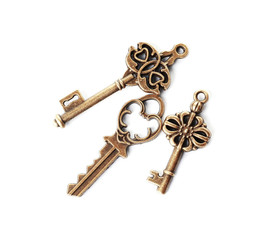 Bronze vintage ornate keys on white background, top view