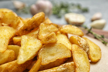 Closeup view of delicious baked potato wedges