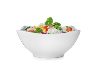 Bowl with tasty rice and vegetables on white background