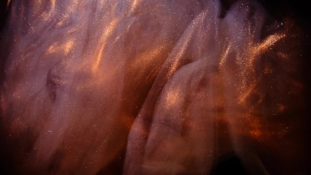 Abstract bronze paint . Shooting on a black background.