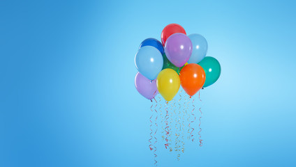 Many bright balloons floating on color background. Space for text