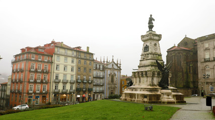 PORTO, PORTUGAL - JUNE 21, 2018: Houses in Porto with the Infante Dom Henrique statue, Porto, Portugal
