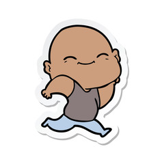 sticker of a cartoon happy bald man