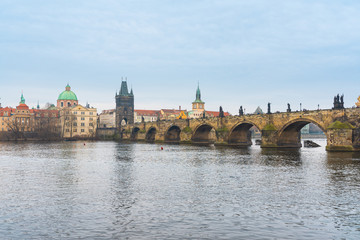 Fototapeta na wymiar Prague, Czech republic. Famous historical Charles bridge that crosses the Vltava river in old town.