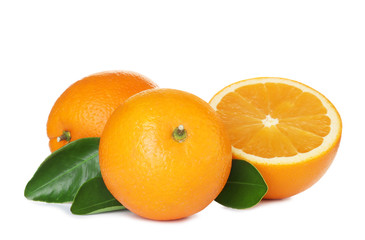 Fresh ripe oranges with leaves isolated on white