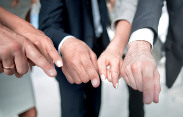 close up. business team pointing at you