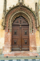 Prague, Czech Republic. Late Gothic door in the house adjacent to the tower serves as the main entrance to the Old Town Hall.
